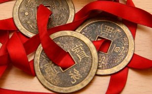 Chinese coins tied with red ribbon